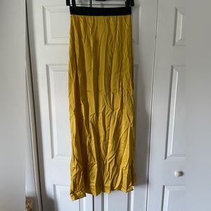 Yellow silk maxi split front skirt. Elastic waistband.
